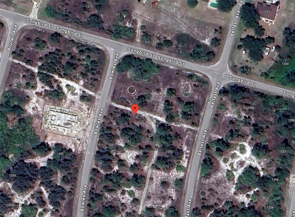 This is an aerial map view of a vacant residential lot located at a street intersection — 1249 BOWLES AVENUE, FORT MYERS, FL