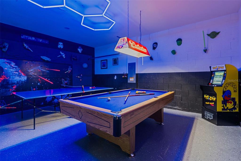 A game room features a pool table, a ping pong table, and a Pac-Man arcade cabinet — 7796 SOMERSWORTH DRIVE, KISSIMMEE, FL