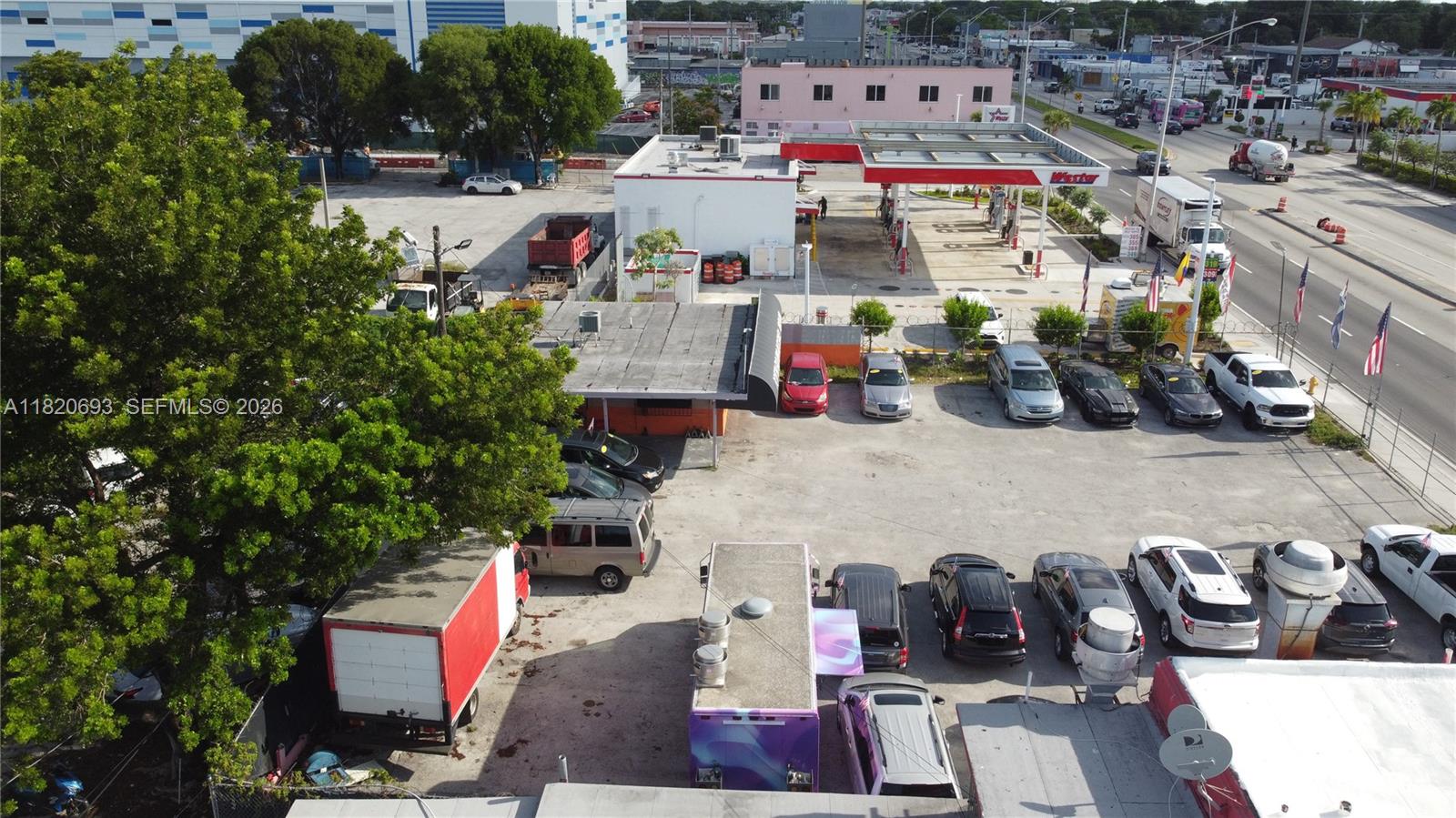 An aerial view shows a commercial property with a gas station and a parking lot — 2156 NW 27th Ave, Miami FL 33142, MIAMI, FL