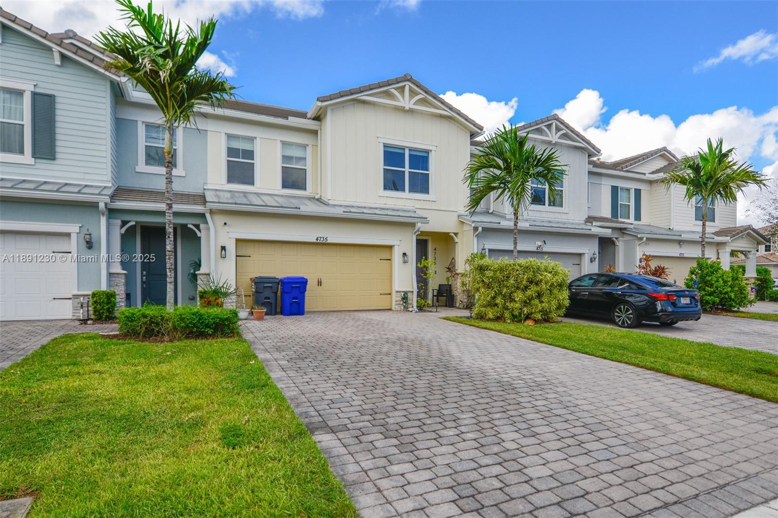A row of two-story townhouses features paved driveways, attached garages, and small front lawns — 4735 Eucalyptus Dr, Hollywood FL 33021, HOLLYWOOD, FL
