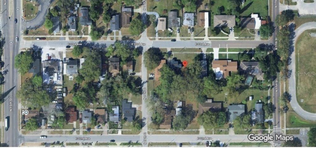 This is an aerial map view of a residential neighborhood block — 1605 E 33RD AVENUE, TAMPA, FL