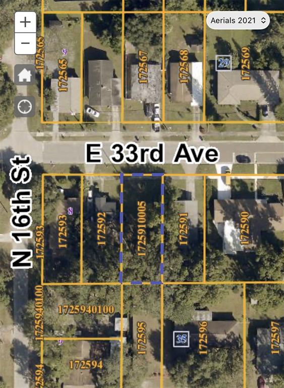 This is a map showing a vacant residential lot outlined in blue on a city street — 1605 E 33RD AVENUE, TAMPA, FL