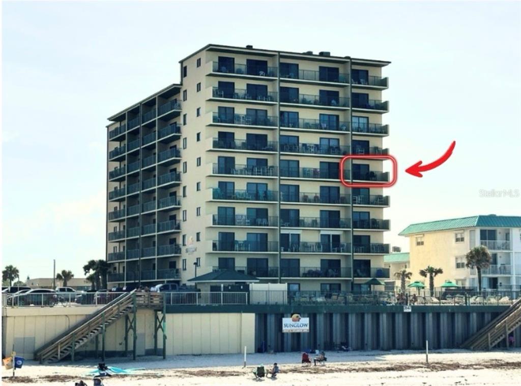 A multi-story beachfront condominium building with a red box highlighting a specific balcony — 3647 S ATLANTIC AVENUE UNIT 6G, DAYTONA BEACH SHORES, FL