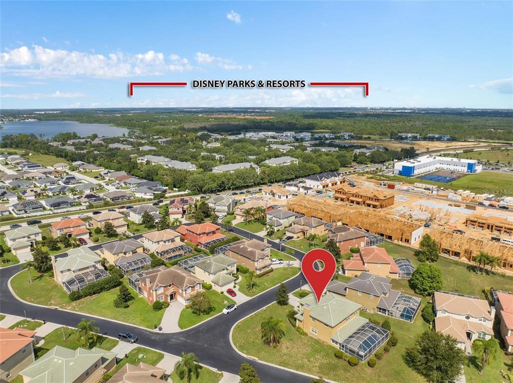 An aerial view shows a residential neighborhood with a red location pin on a house — 426 VISTA LOOP, DAVENPORT, FL
