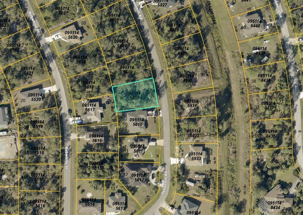 This is an aerial map showing property lot lines and parcel numbers for a residential neighborhood — SPOONHILL ROAD, NORTH PORT, FL