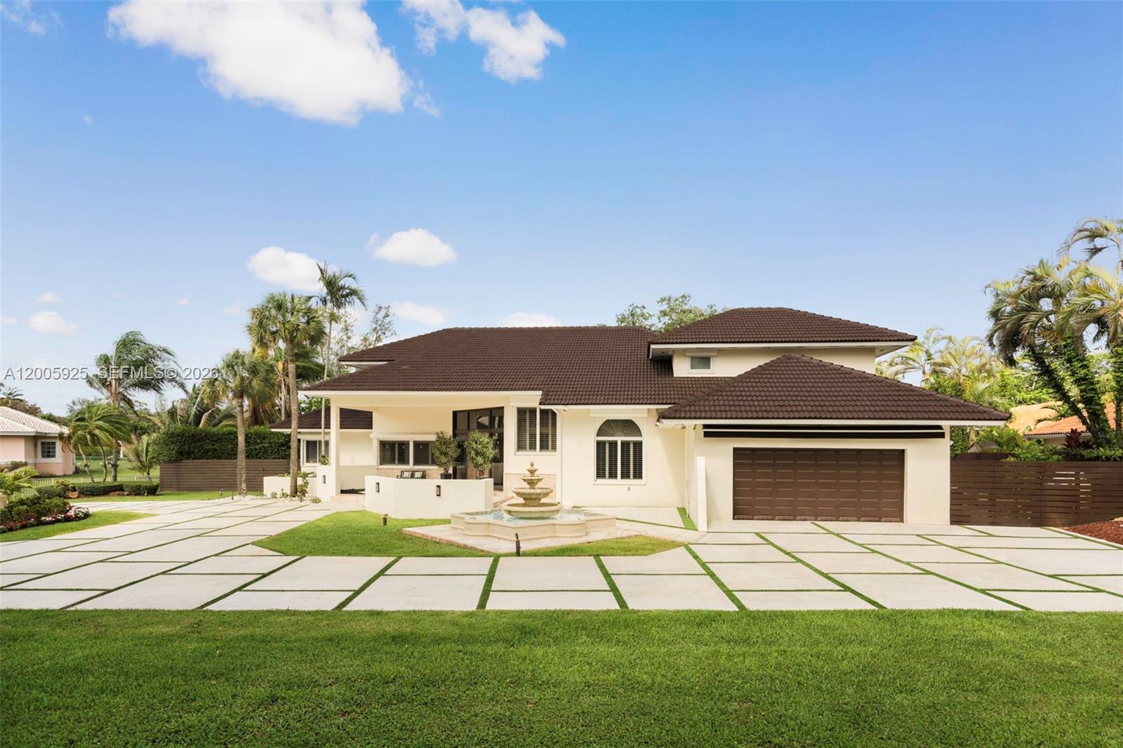 A single-story house with a brown tile roof, a fountain, and a paved driveway — 8841 SW 103rd St, Miami FL 33176, MIAMI, FL