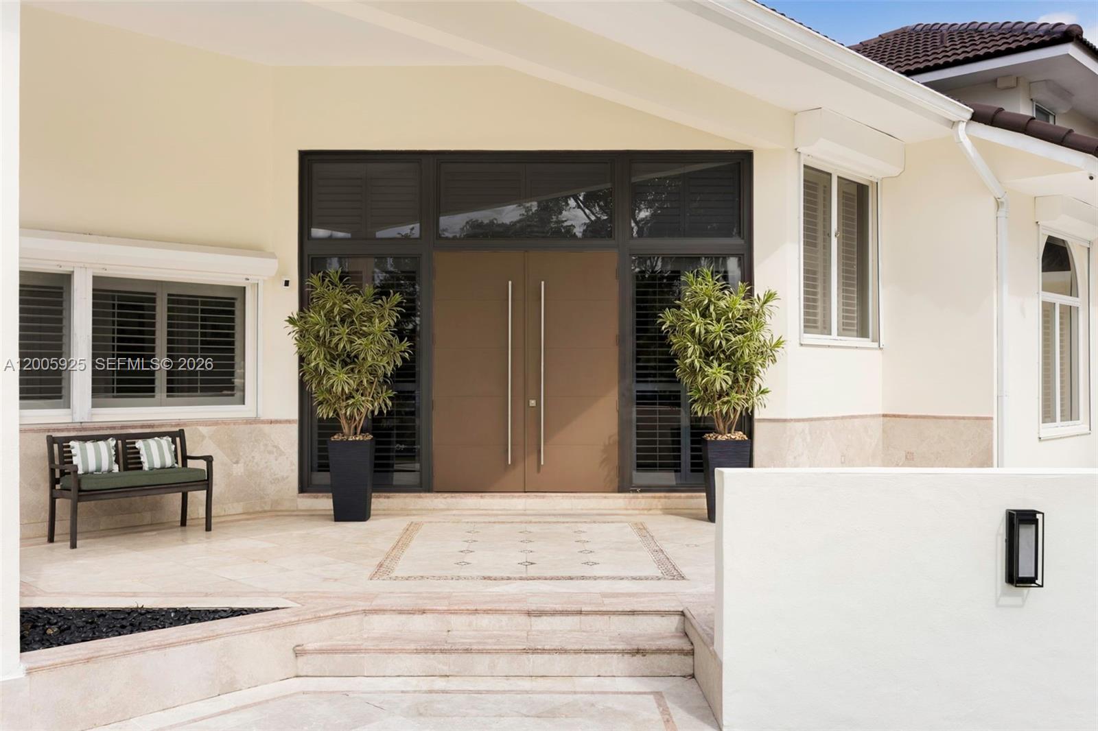 The exterior entrance features double doors, potted plants, a bench, and stone steps — 8841 SW 103rd St, Miami FL 33176, MIAMI, FL
