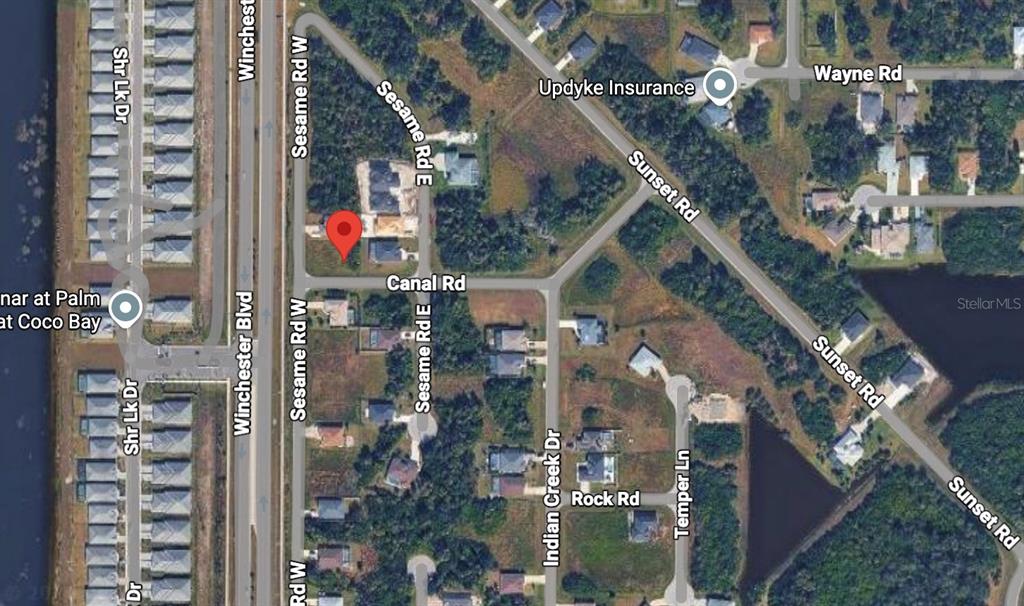 This is an aerial map view showing a residential lot marked with a red pin — 100 CANAL ROAD, ROTONDA WEST, FL