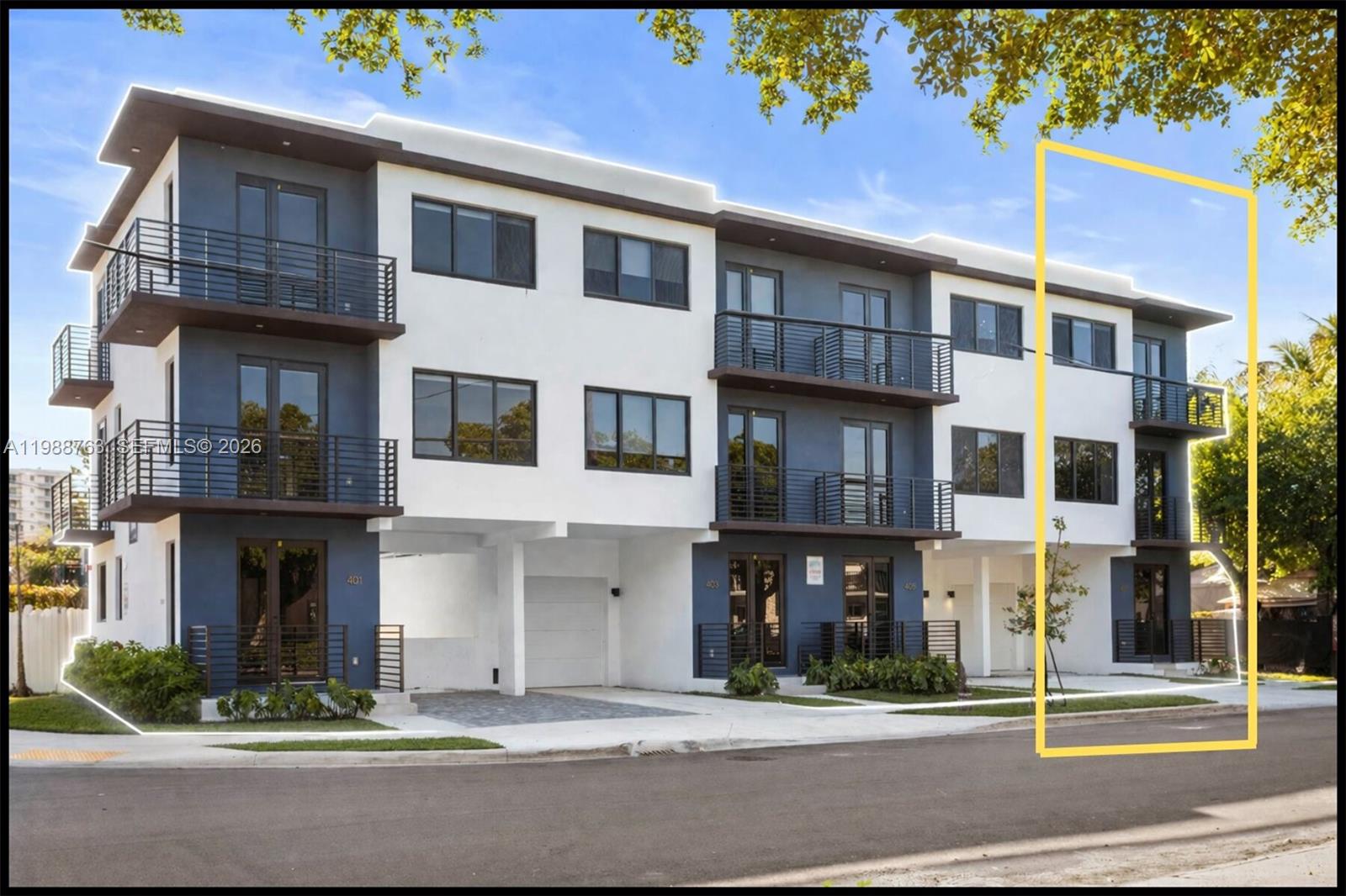 A modern three-story townhouse building with white and blue exterior walls and metal balconies — 1376 SW 4th St # 7, Miami FL 33135, MIAMI, FL