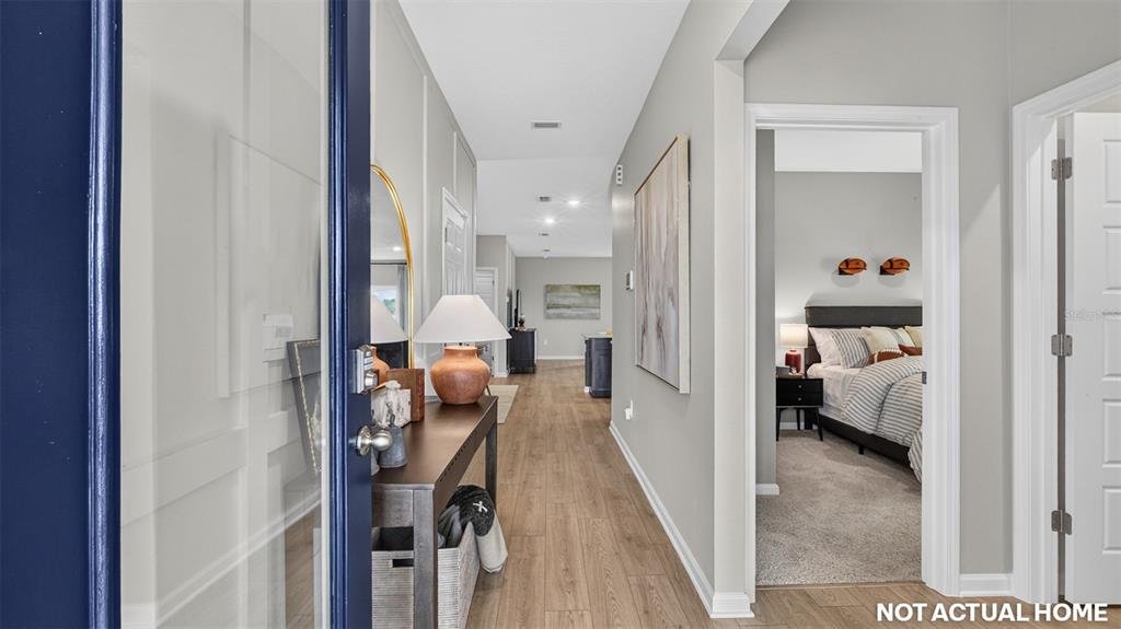 This is a rendering of a home entryway leading to a hallway and a bedroom — 12 SAWDUST LANE, PALM COAST, FL