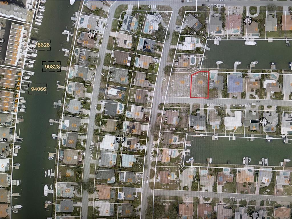 This is an aerial map showing residential properties, canals, and streets in a coastal neighborhood — 9 TH STREET E, TIERRA VERDE, FL