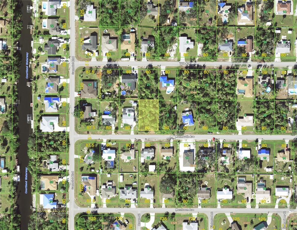 This is an aerial map showing residential lots and streets in a suburban neighborhood — 18292 MONMOUTH AVENUE, PORT CHARLOTTE, FL