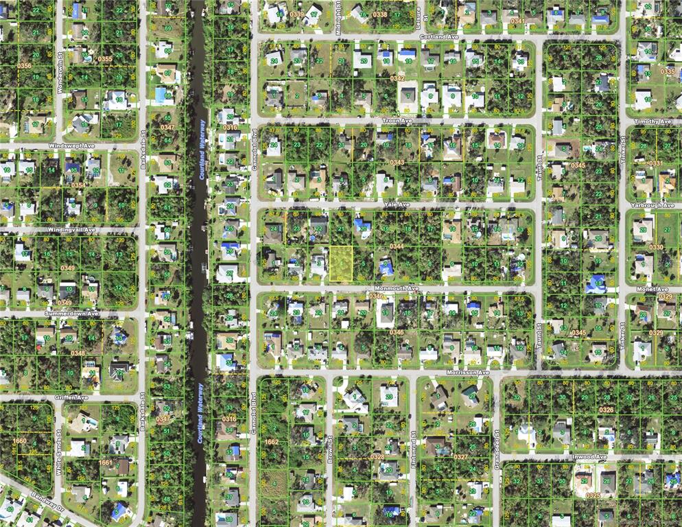 This is an aerial map showing residential lots and streets in a suburban neighborhood — 18292 MONMOUTH AVENUE, PORT CHARLOTTE, FL