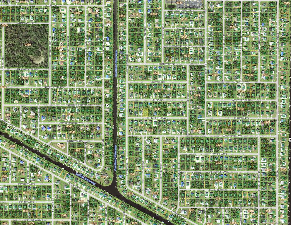 This is an aerial map showing a residential neighborhood with streets and canal waterways — 18292 MONMOUTH AVENUE, PORT CHARLOTTE, FL