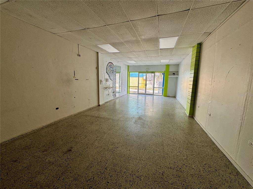 An empty commercial space with white walls, a drop ceiling, and speckled flooring — 8 DR. VIDAL, HUMACAO, PR