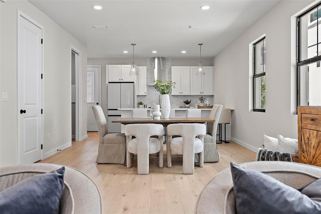 A dining area with a wooden table and chairs sits in front of a kitchen — 423 11TH AVENUE S, ST PETERSBURG, FL