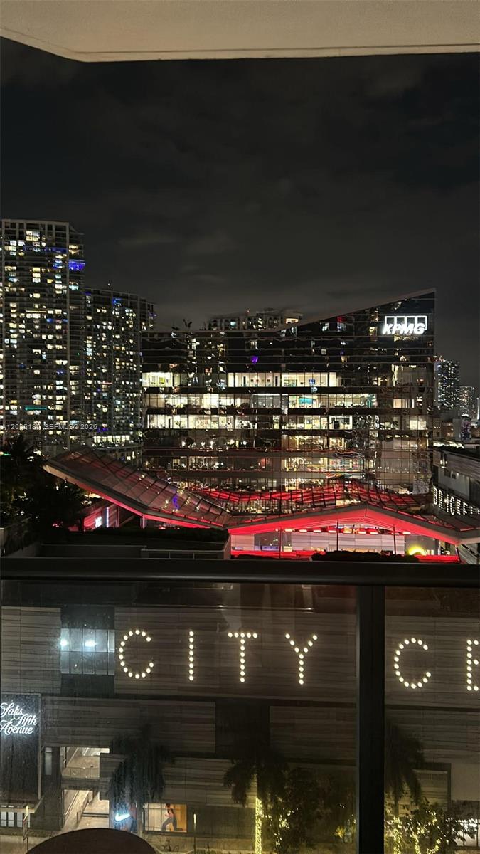 A night view from a balcony overlooking the illuminated Brickell City Centre complex — 45 SW 9th St # 1409, Miami FL 33130, MIAMI, FL