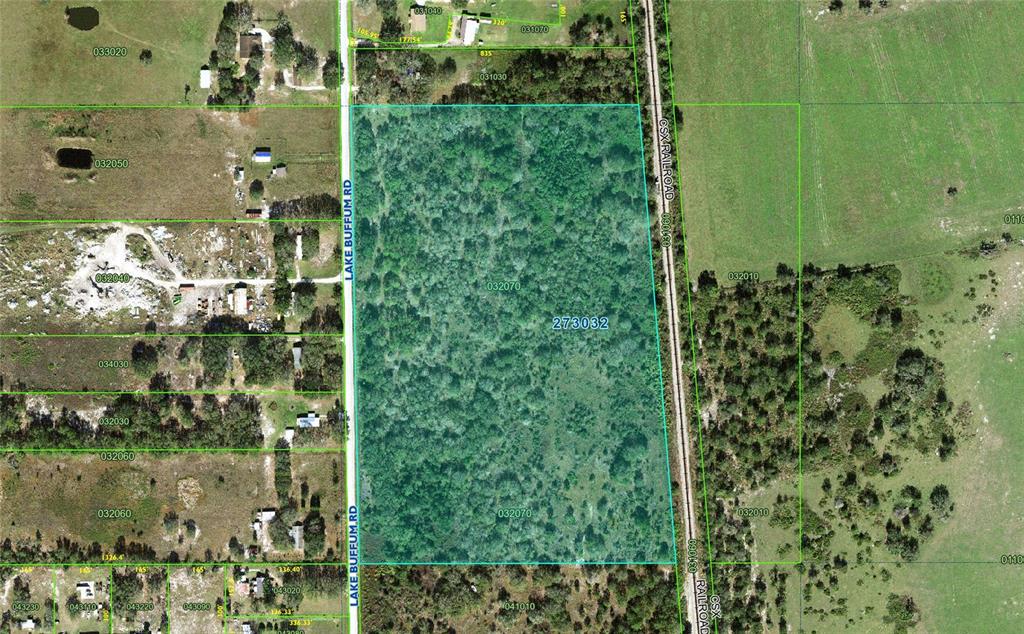 This is an aerial map showing a wooded parcel of land bordered by a railroad — 0 LAKE BUFFUM ROAD, LAKE WALES, FL