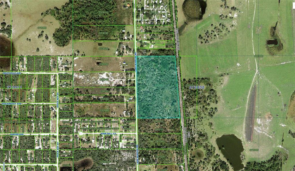 This is an aerial map showing a large wooded parcel of land next to railroad tracks — 0 LAKE BUFFUM ROAD, LAKE WALES, FL