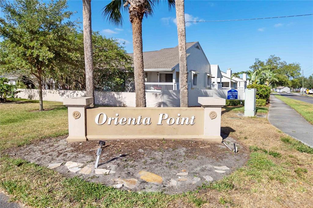A tan monument sign for Orienta Point stands in front of a residential apartment building — 440 ORIENTA POINT STREET, ALTAMONTE SPRINGS, FL