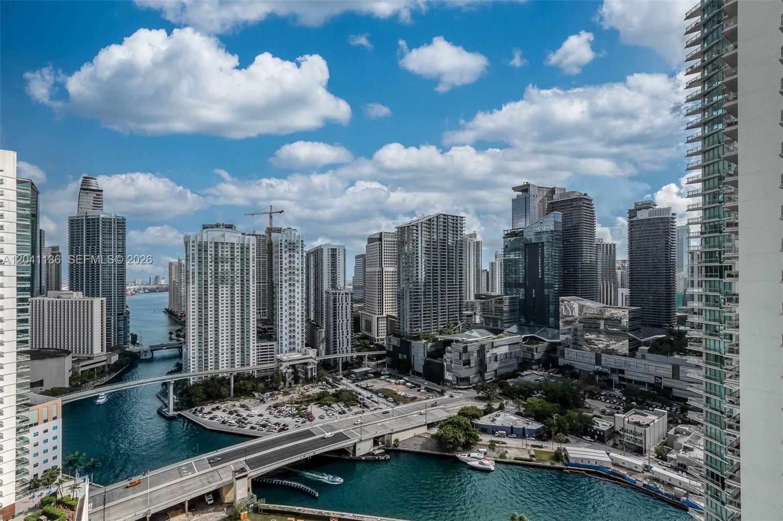 An elevated view of the Miami skyline featuring high-rise buildings, a river, and a bridge — 90 SW 3rd St # 3211, Miami FL 33130, MIAMI, FL