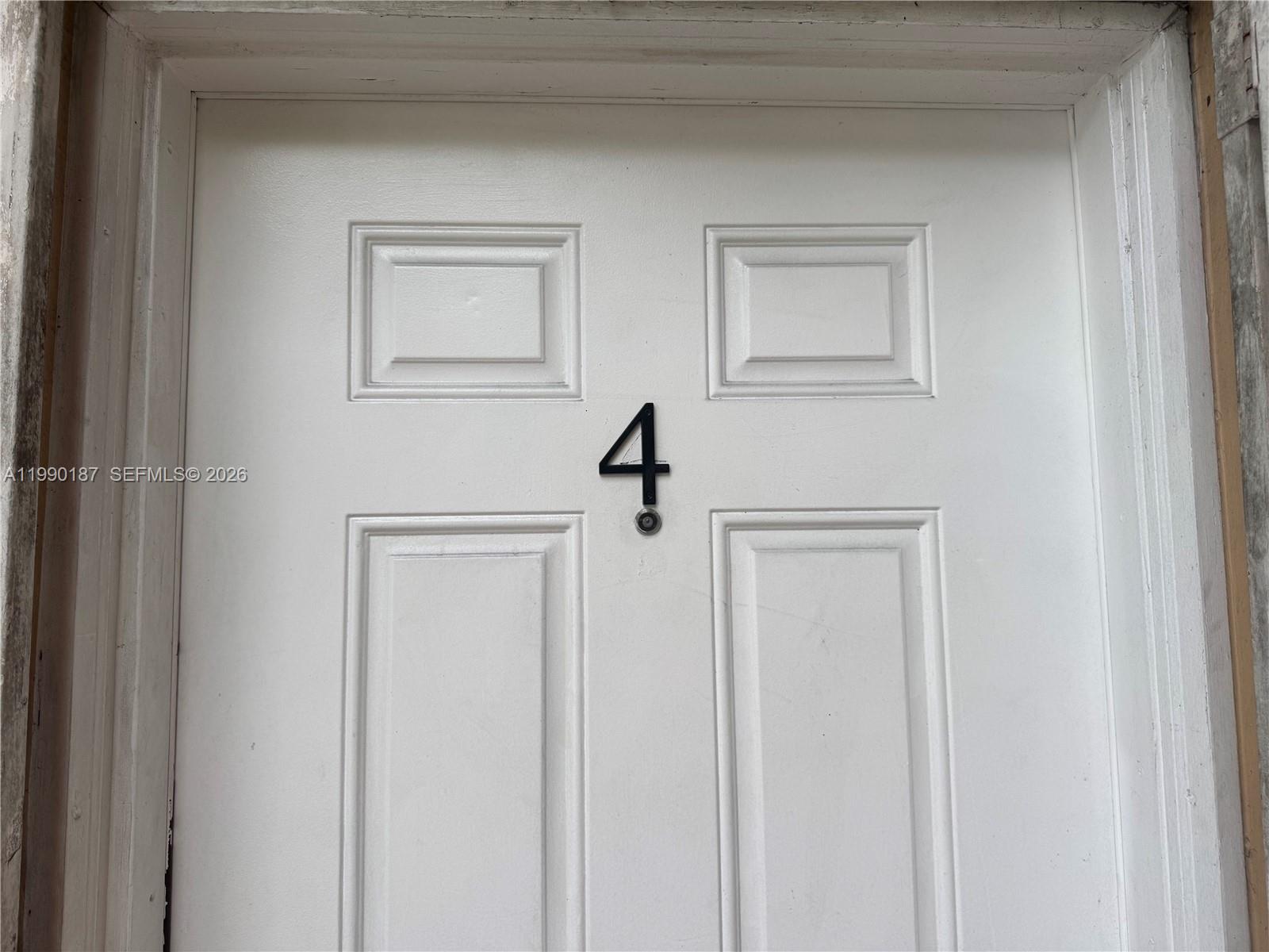 A white door features a black number four and a small circular peephole — 11 SW 32nd Ave # 4, Miami FL 33135, MIAMI, FL