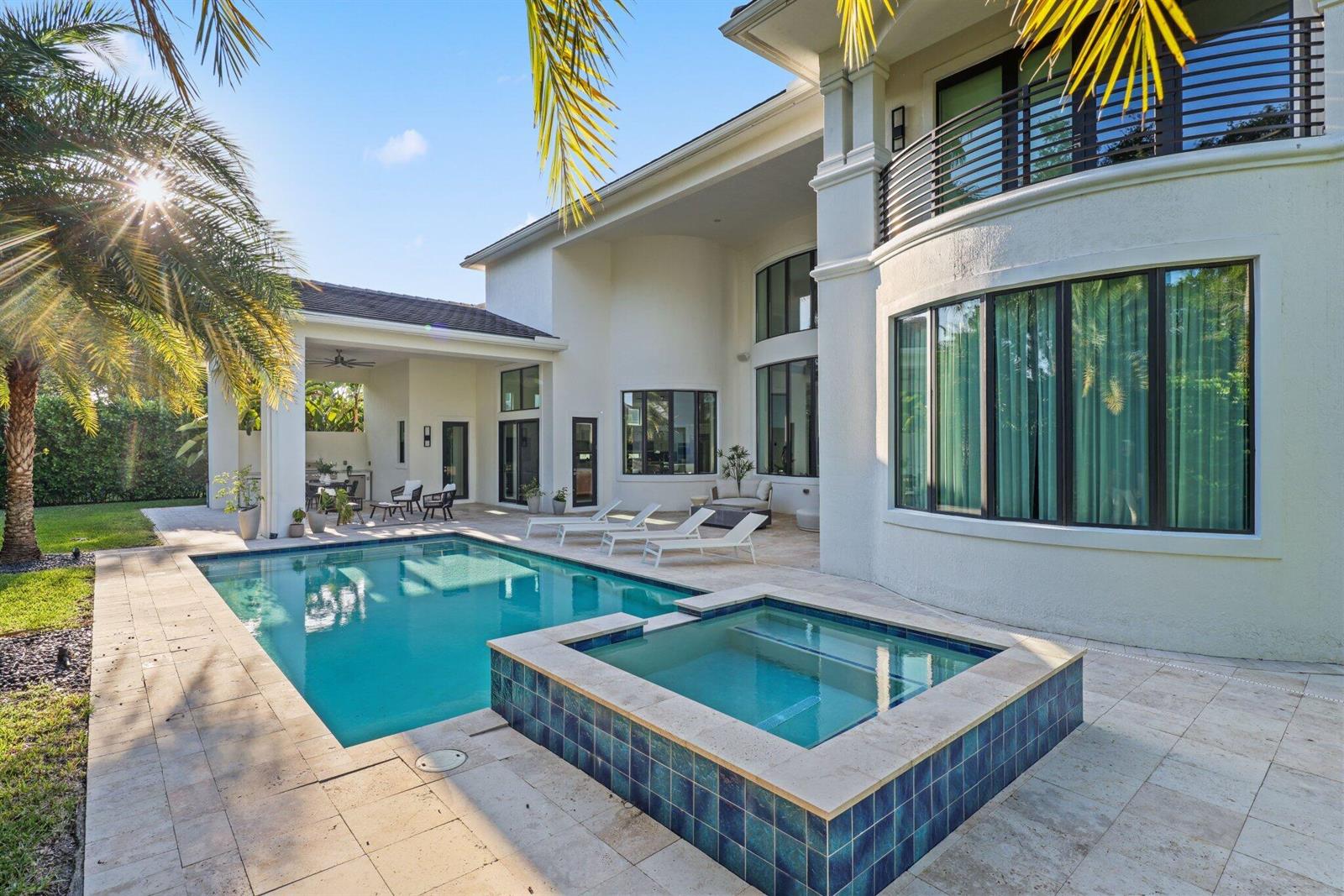 A two-story house exterior features a swimming pool, a raised hot tub, and a patio — 2702 NW 71st Boulevard, Boca Raton FL 33496, BOCA RATON, FL