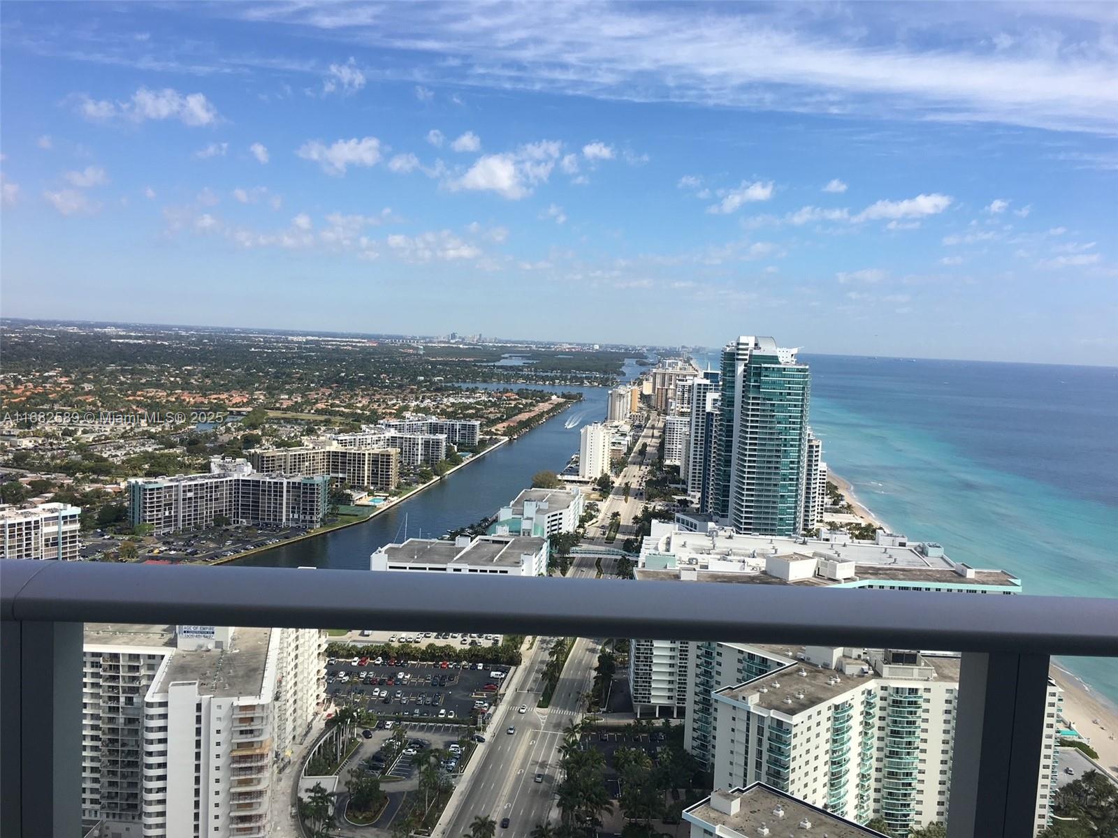 An elevated view of a coastal city featuring high-rise buildings, a waterway, and the ocean — 4111 S Ocean Dr # 3312, Hollywood FL 33019, HOLLYWOOD, FL