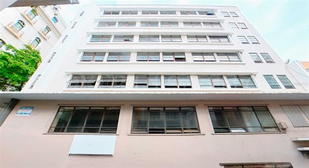 A low-angle exterior view of a multi-story commercial building with rows of windows — 201 TETUAN STREET, SAN JUAN, PR