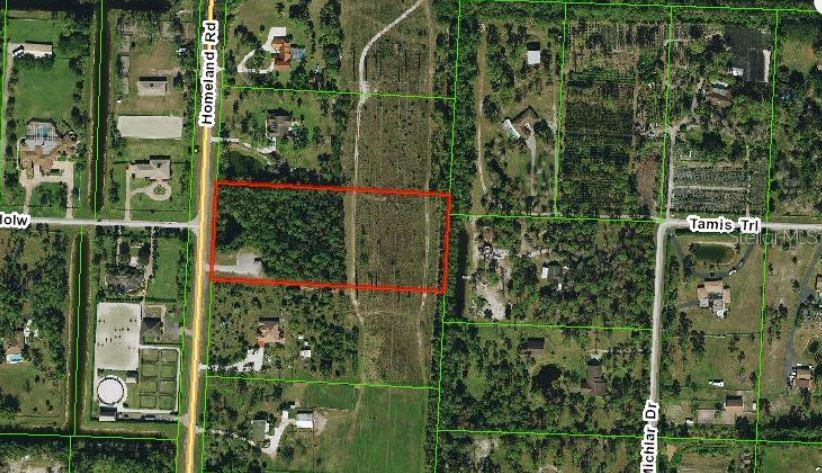 An aerial map view shows a rectangular plot of land outlined in red near roads — 5114 HOMELAND ROAD, WELLINGTON, FL