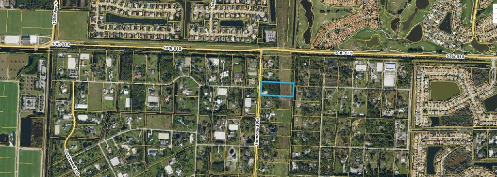 This is an aerial map showing a rectangular property highlighted in blue near a road — 5114 HOMELAND ROAD, WELLINGTON, FL