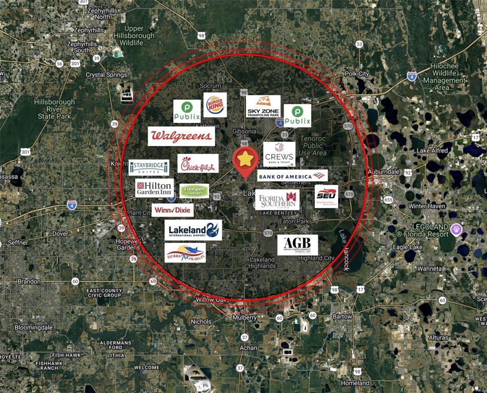 This map shows a red circular radius centered on a star over Lakeland, Florida — 0 10TH STREET W, LAKELAND, FL