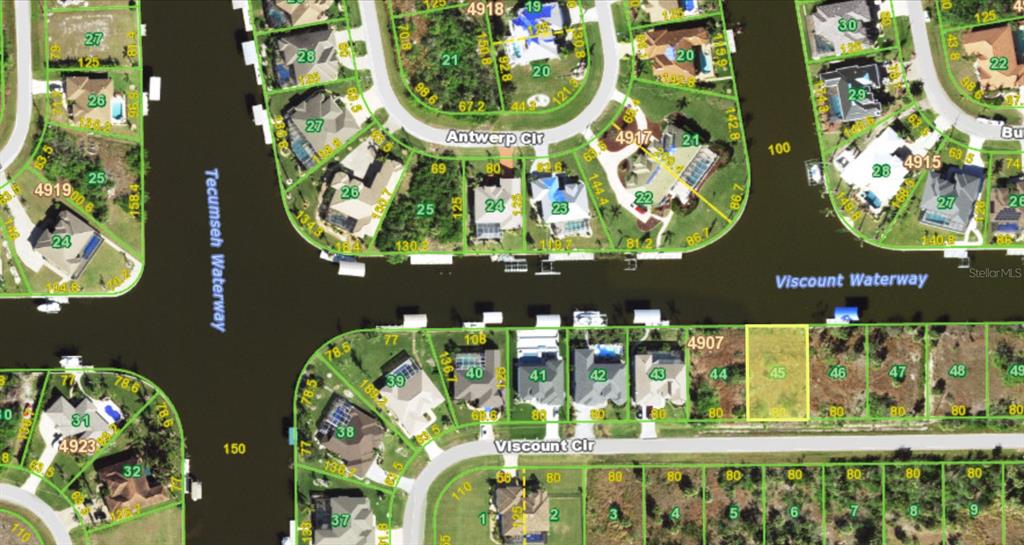 This is a satellite map showing residential lots and waterways in a suburban neighborhood — 15610 VISCOUNT CIRCLE, PORT CHARLOTTE, FL