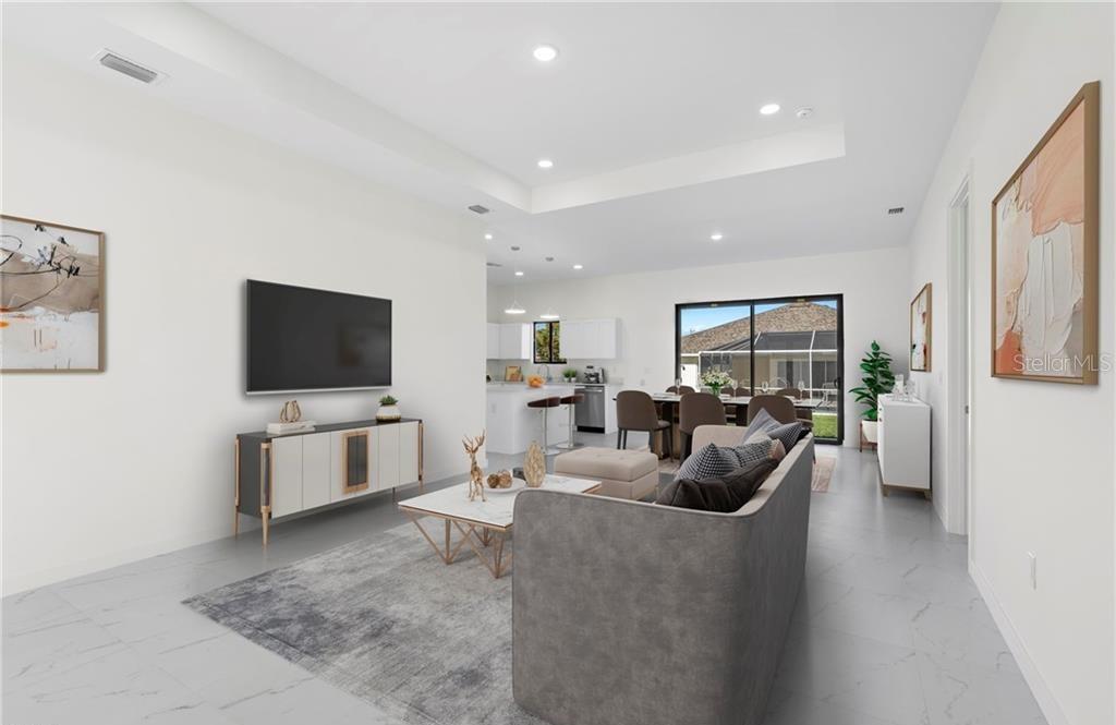 This is a digital rendering of an open-concept living room with tile floors and kitchen — 4233 JACARANDA PARKWAY W, CAPE CORAL, FL