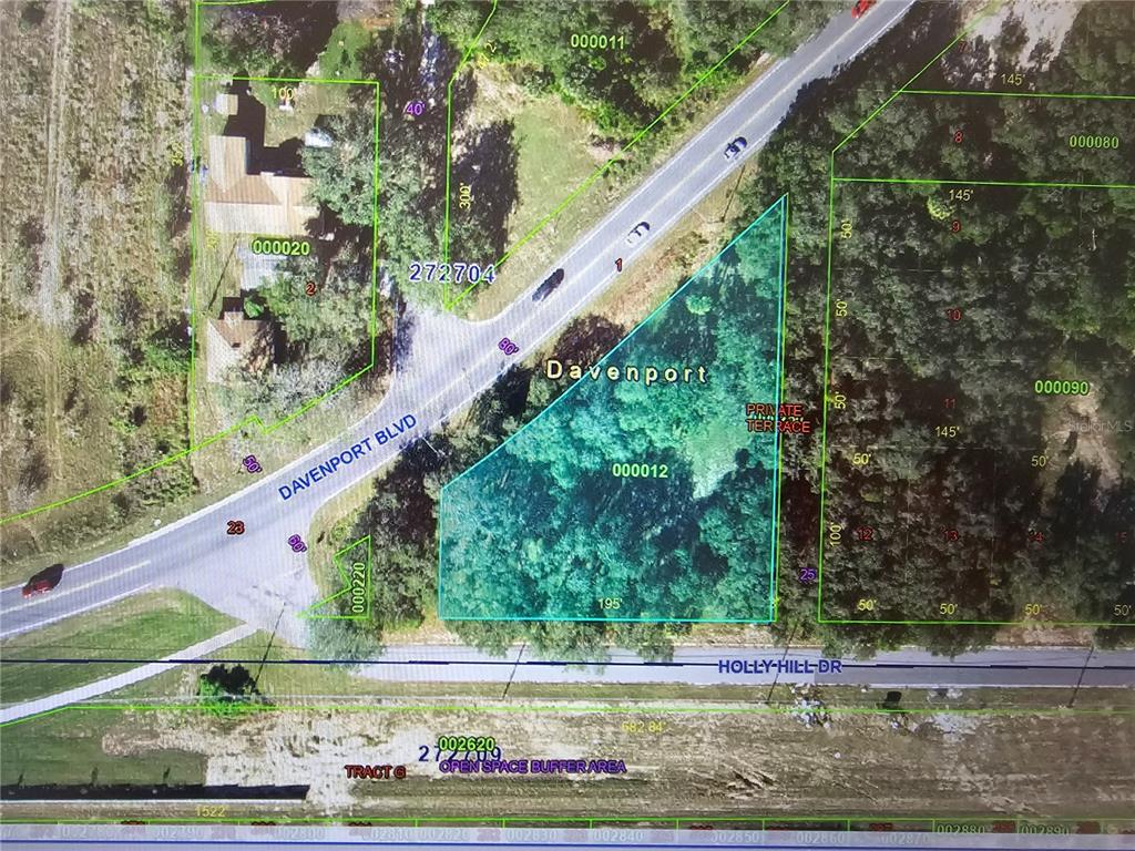 This is a map showing a highlighted parcel of land located at a road intersection — 12 HOLLY HILL DRIVE, DAVENPORT, FL