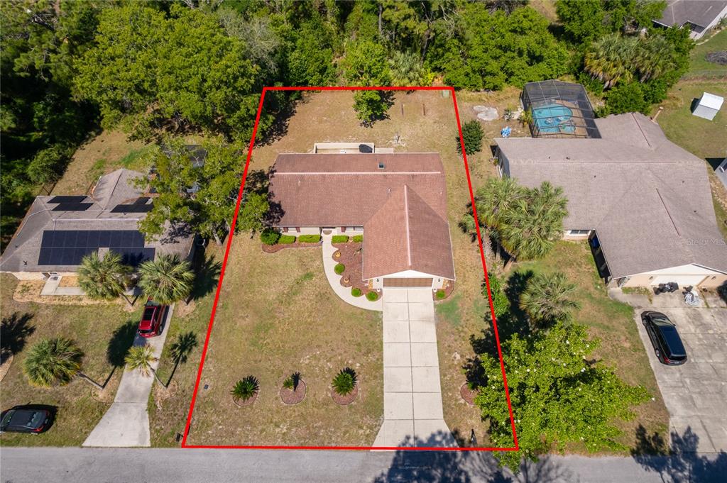 An aerial view shows a single-story house with a brown roof and a large front yard — 14604 SW 45TH COURT, OCALA, FL