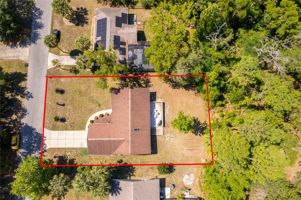 An aerial view shows a house with a brown roof and a large backyard — 14604 SW 45TH COURT, OCALA, FL