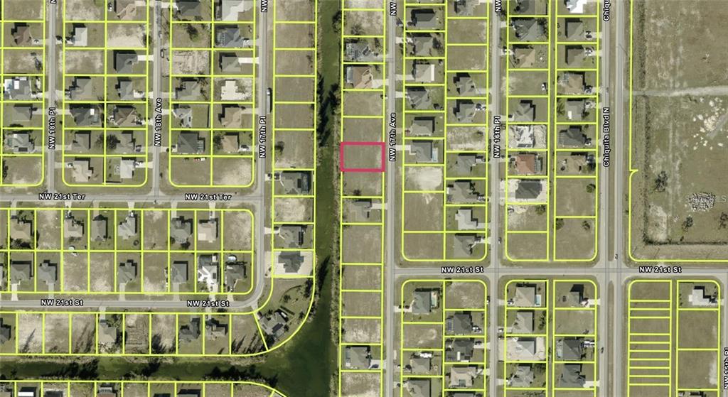 This is an aerial map showing a vacant residential lot highlighted in pink — 2116 NW 17TH AVENUE, CAPE CORAL, FL