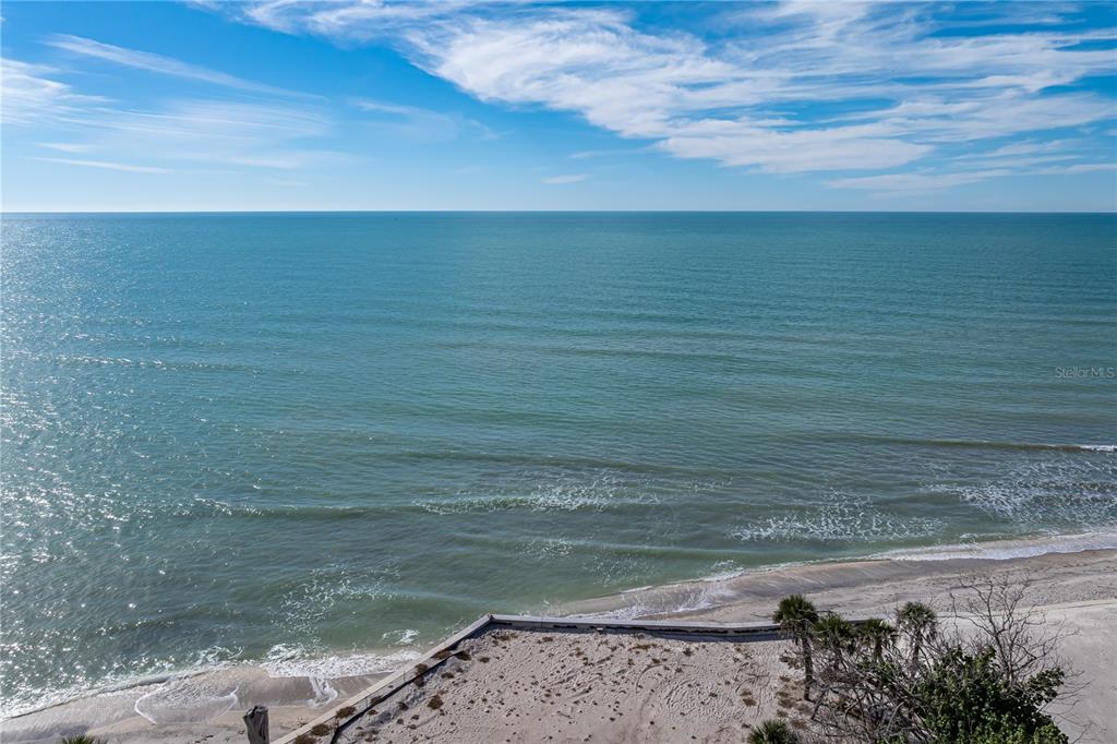 An elevated view of a sandy beach and the ocean under a blue sky — 7210 MANASOTA KEY ROAD, ENGLEWOOD, FL