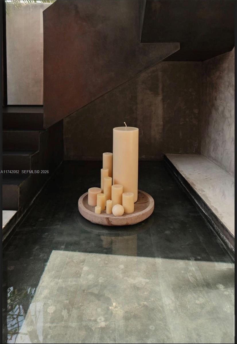 A collection of pillar candles sits on a circular tray within a shallow water feature — Tulum region 15 Mnz 327 lotes 007, ., .