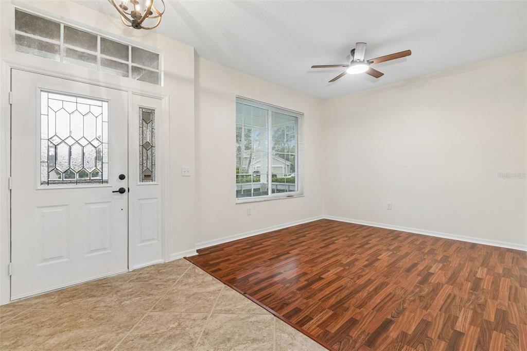 A single-story house with a beige exterior, a two-car garage, and a manicured front lawn — 5306 WATERLEAF COURT, VALRICO, FL