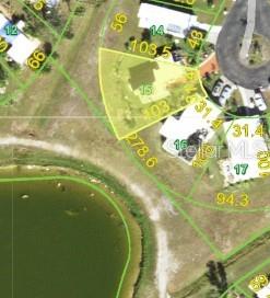 This is a satellite map view showing a residential lot highlighted in yellow — 7357 ADANA AVENUE, PORT CHARLOTTE, FL