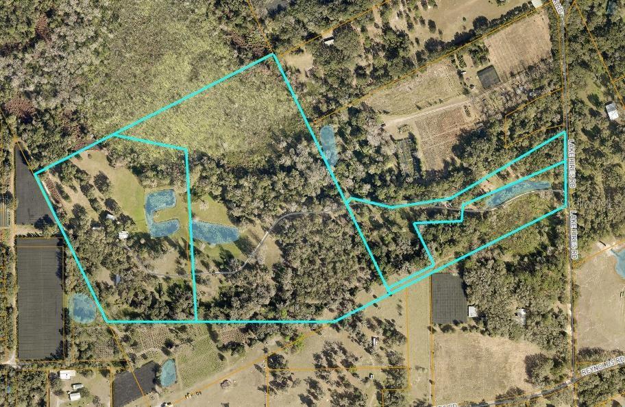 An aerial map shows a large, wooded property with several ponds and a private driveway — 1980 LAKE HIRES ROAD, DE LEON SPRINGS, FL
