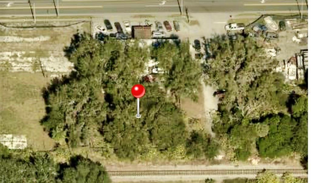 This aerial view shows a wooded lot with a red location pin — S FRANKLIN STREET, PLANT CITY, FL