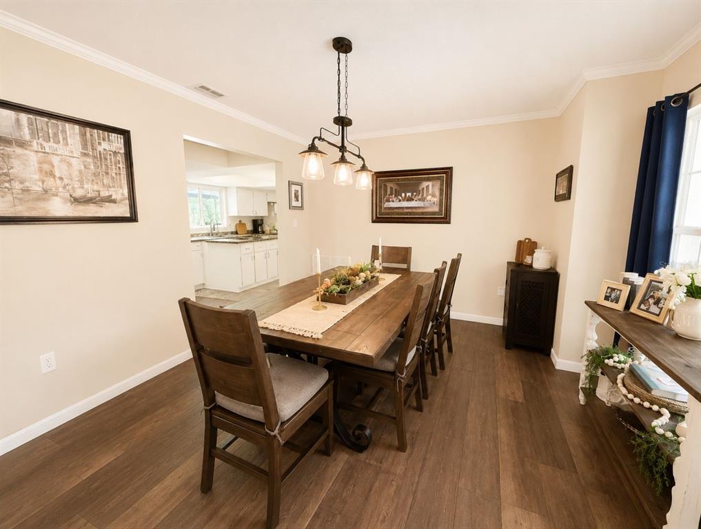 A bright entryway features a high ceiling, tile flooring, double front doors, and wooden furniture — 44131 PARKWAY LANE, ALTOONA, FL