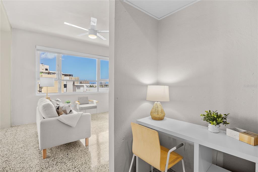 A view from a small office space into a living room with a large window — 603 MIRAMAR AVENUE UNIT 7, SAN JUAN, PR