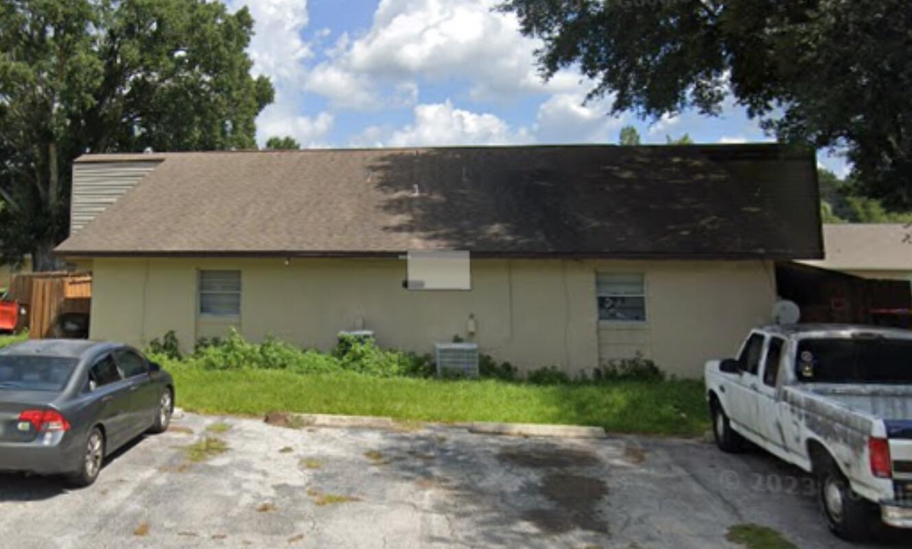 The exterior view shows the back of a single-story building with a parking lot — 5121 SE 30th Street, Ocala FL 34480, OCALA, FL