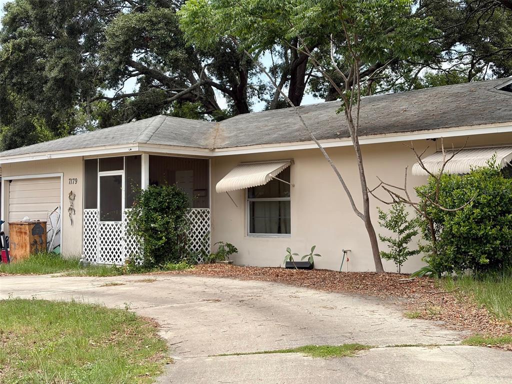 A room with a pool table, a desk, a dog, and a ceiling fan — 7179 SPRING HILL DRIVE, SPRING HILL, FL