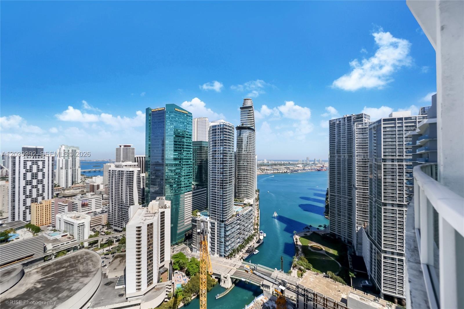 An elevated view of the Miami skyline featuring high-rise buildings, a river, and the bay — 41 SE 5th St # 2409, Miami FL 33131, MIAMI, FL