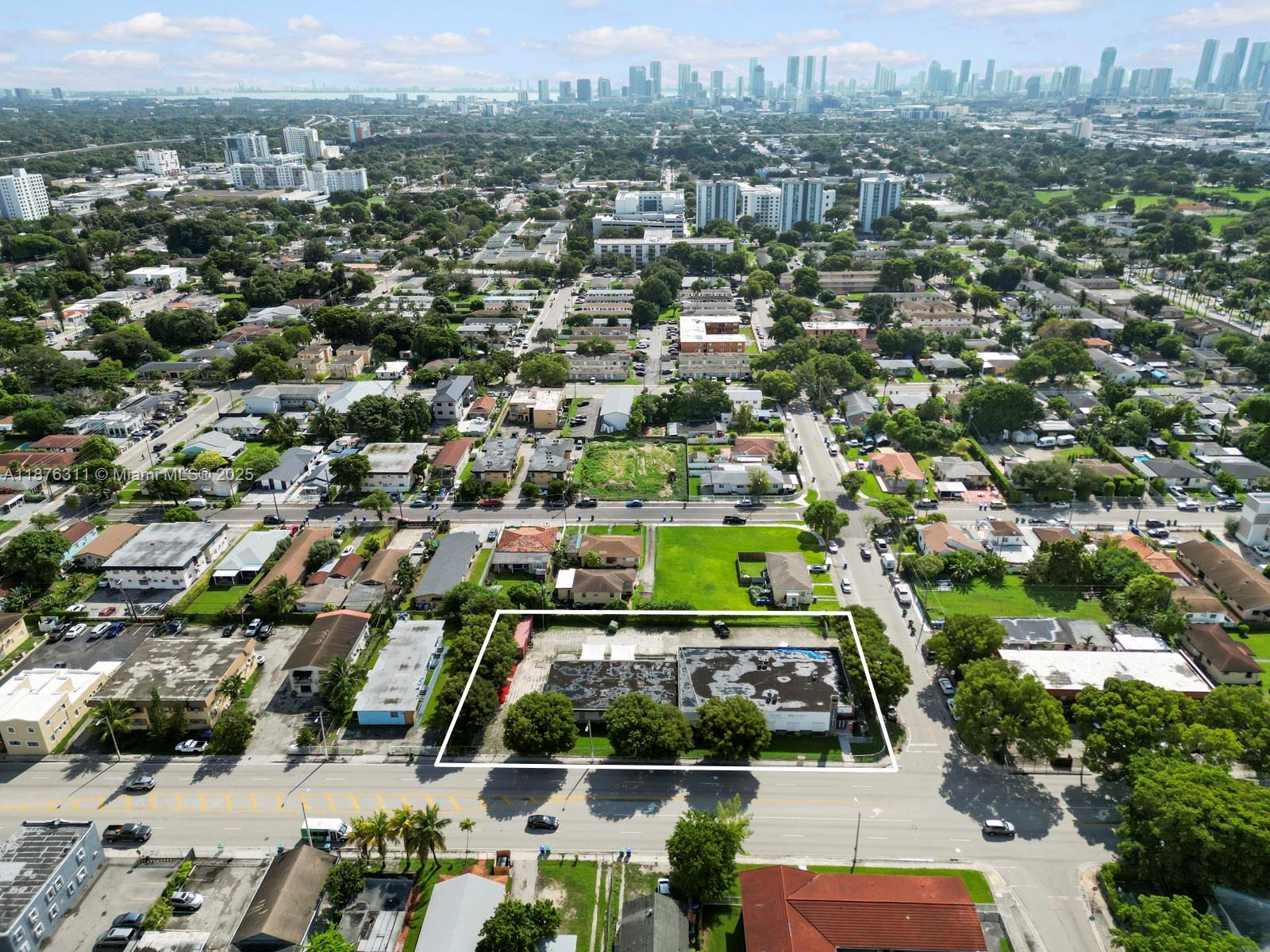 An aerial view shows a rectangular commercial building lot outlined in white within a neighborhood — 3001 NW 22nd Ave, Miami FL 33142, MIAMI, FL